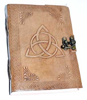 Leather-bound book with Celtic knotwork and metal clasp, related to Celtic spirituality and druidry.