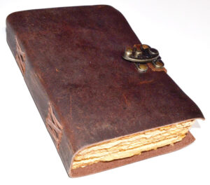 Old leather book with metal clasp, related to Celtic spirituality and druidry.