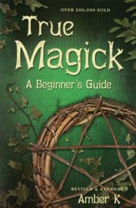 Cover of a book titled "True Magick" with a green background and a circular wooden symbol.