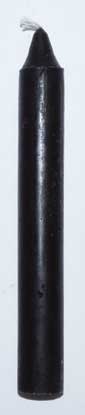 A close-up of a black ink stick used for traditional calligraphy and spiritual practices.