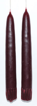Red candles with subtle Celtic design elements.