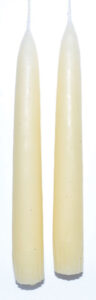 Two white candles suitable for Celtic spiritual practices and nature-based rituals.