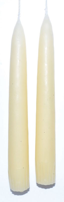 Two white candles suitable for Celtic spiritual practices and nature-based rituals.