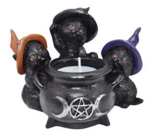 Cauldron with three small witch hats, featuring a pentagram symbol, used for Celtic spiritual practi.