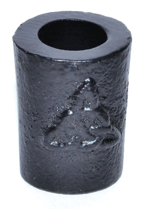 Black cylindrical candle holder with Celtic knot design, made of textured material.