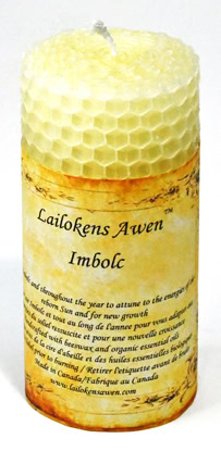Candle with honeycomb pattern and handwritten label.