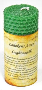 Candle with green honeycomb pattern and a yellow label with Celtic text.