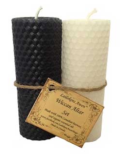Celtic-inspired beeswax candles in black and white with textured surface and rustic label.