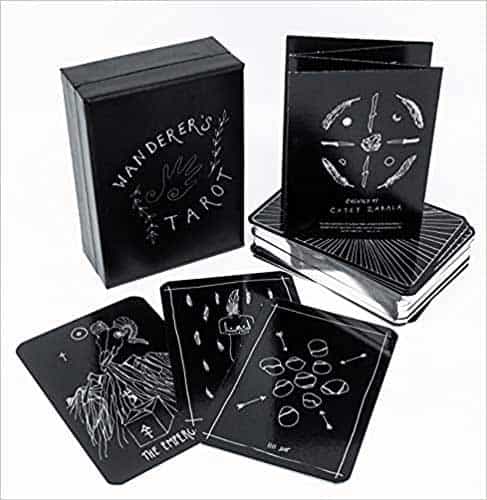 Modern tarot deck with Celtic-inspired designs and black packaging for spiritual guidance.