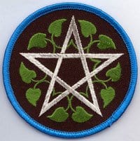 Patch featuring a pentagram and green clover leaves.