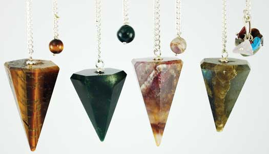 Stone pendulum set with various colored stones and chains for spiritual practices.