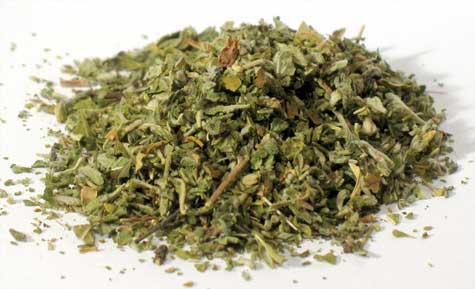 Herbal mixture with dried leaves and small twigs, used in Celtic spiritual rituals and nature-based.