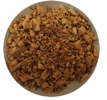 Dried herbal mixture with small, irregularly shaped pieces in a white bowl.