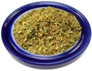 Herbs in a blue bowl, used in Celtic spirituality and nature-based rituals.