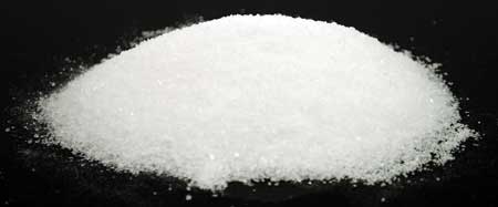 Salt pile on black background, used in Celtic spiritual practices and rituals.