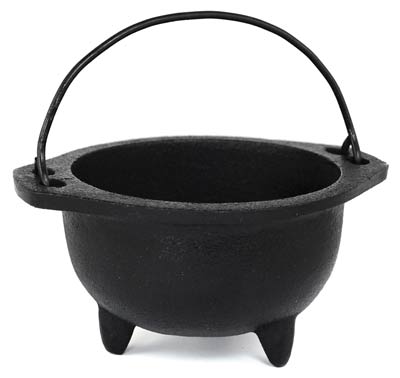 Small black cauldron with handle, used in Celtic spiritual practices and rituals.