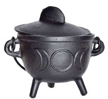 Black cauldron with three legs, used in Celtic spiritual practices and rituals.