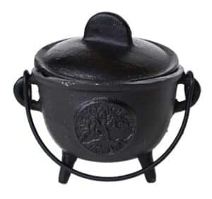 Cauldron with tree emblem, used in Celtic spiritual practices and rituals.