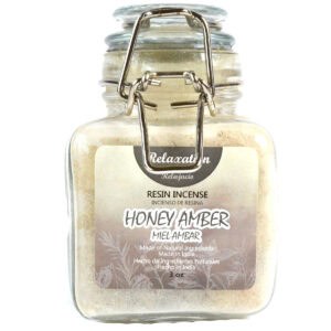 Resin incense jar labeled "Honey Amber" with a metal clasp and a beige label.