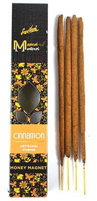 Cinnamon incense sticks in a decorative box, used for spiritual practices and meditation.