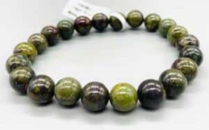 Bracelet made of green and black polished round stones.