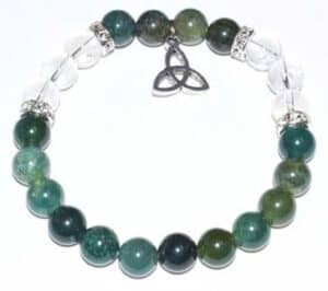 Bracelet featuring green and clear beads with a triquetra pendant, symbolizing Celtic spirituality a.