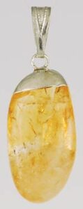 Pendant featuring a polished amber stone with natural inclusions.
