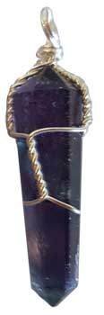 Amethyst crystal pendant wrapped in silver wire, suitable for spiritual and healing practices.