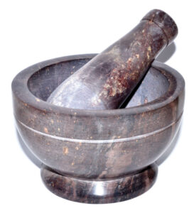Mortar and pestle used for grinding herbs and natural materials in Celtic practices.