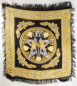 Celtic knotwork and symbolic design on a black and gold cloth, featuring a central figure and intric.