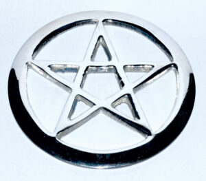 Metal pentacle pendant with star design, related to Celtic spirituality and nature veneration.