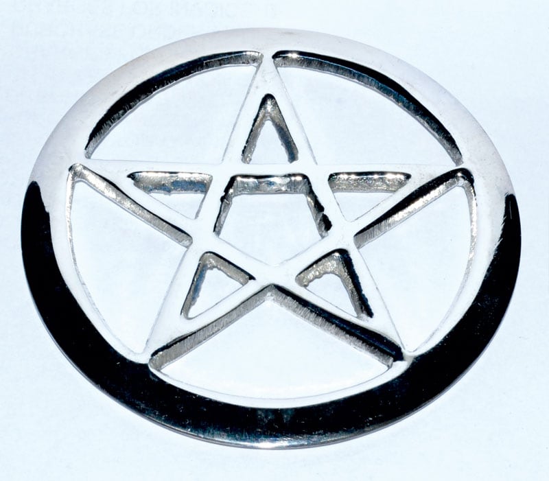 Metal pentacle pendant with star design, related to Celtic spirituality and nature veneration.