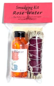 Small rose water smudging kit with herbs and essential oil for spiritual cleansing.