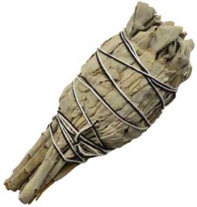 Herbal bundle tied with string for spiritual or ritual use.
