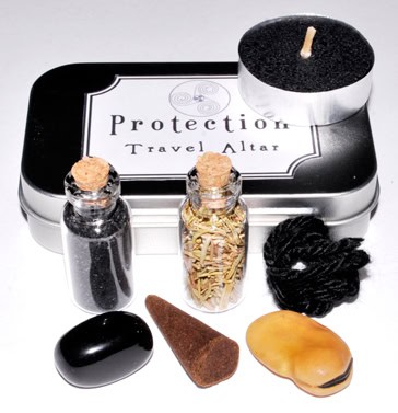 Protection Travel Altar with stones, herbs, and a candle for Celtic spiritual practices.