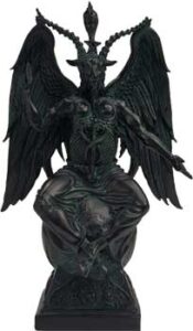 Statue of a Celtic deity with wings and horns, seated on a base.