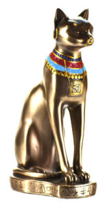 Gold cat statue with jewelry and symbols, reflecting Celtic spirituality and nature veneration.