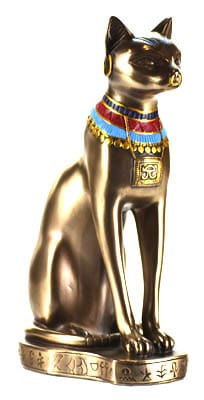 Gold cat statue with jewelry and symbols, reflecting Celtic spirituality and nature veneration.