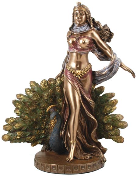 Statue of a Celtic goddess with peacock and foliage, representing nature and spiritual connection.