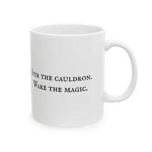 White ceramic mug with black text "Stir the cauldron. Wake the magic.".