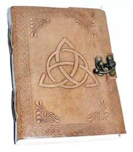 Leather-bound book with Celtic knotwork and metal clasp, related to Celtic spirituality and druidry.