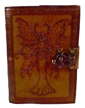 Wooden book cover with carved butterfly design, featuring a metal latch, reflecting Celtic artistry.