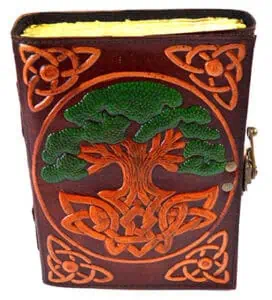 Leather book cover with Celtic knot and tree design.