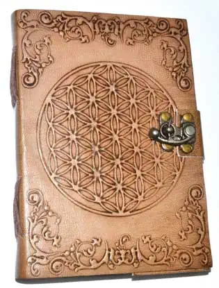 Leather journal with intricate geometric pattern and decorative corner motifs.