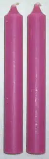 Two pink candles standing upright, smooth surface, simple design.