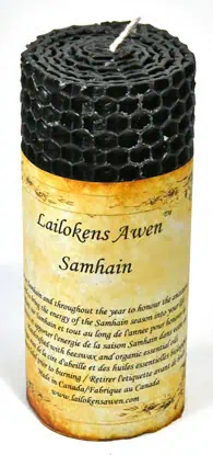 Beeswax candle with honeycomb pattern and Celtic inscription.