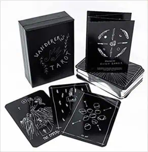 Modern tarot deck with Celtic-inspired designs and black packaging for spiritual guidance.
