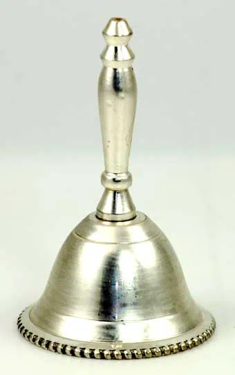 Bell with a metallic finish and decorative edge, used in spiritual or ritual practices.