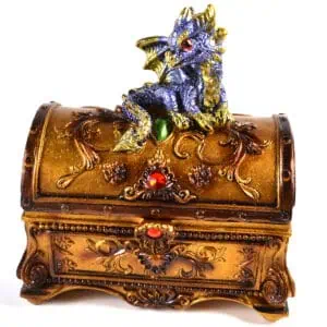 Treasure chest with a detailed dragon figurine on top, decorated with colorful gemstones.
