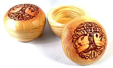 Wooden containers with engraved Ogham symbols for Celtic spiritual practices.